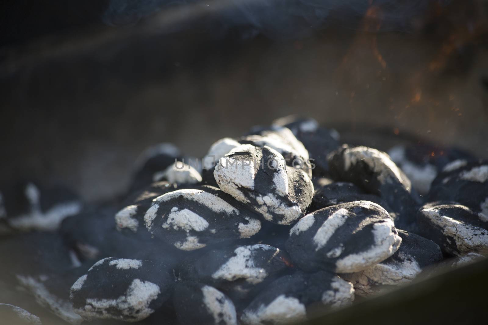 Smoking charcoal with small flame