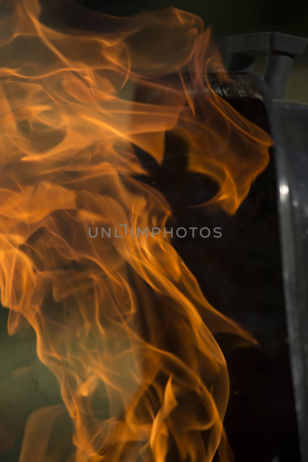 Close-up of flames shooting from grill