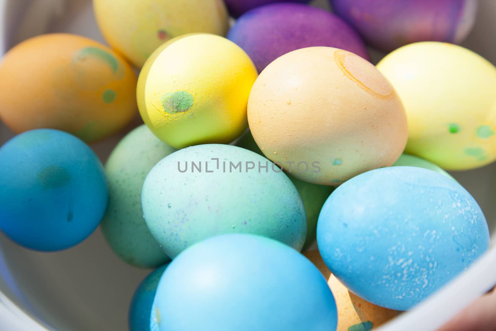 Multicolored Easter eggs in bucket