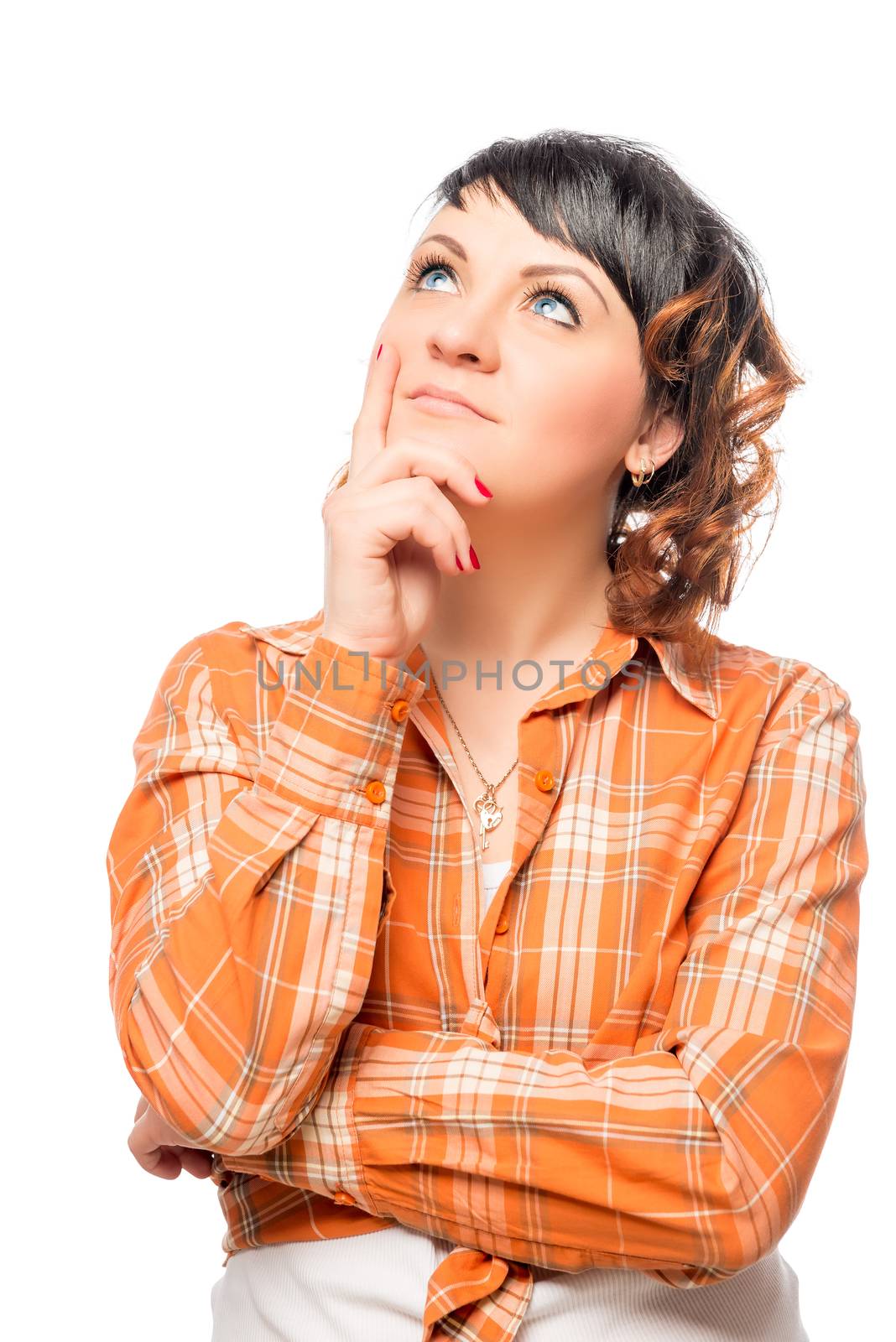 thoughtful brunette in orange shirt on a white background