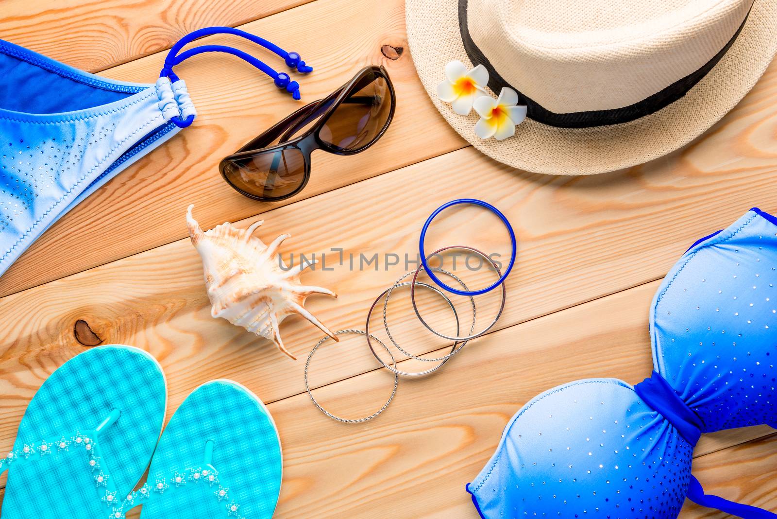 women's clothing and accessories are collected for a trip to a resort view from above