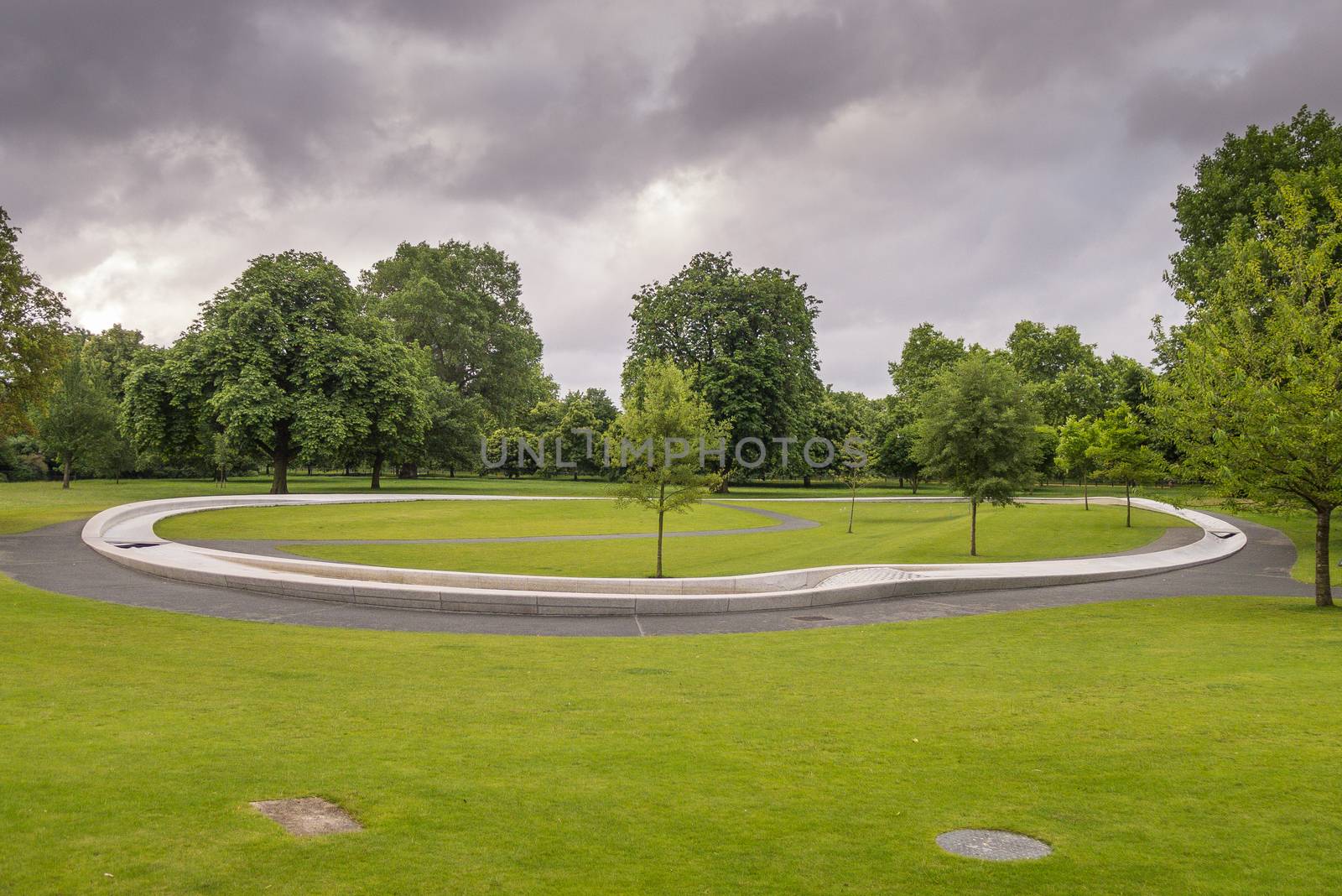 This free entry unique Memorial to Diana, Princess of Wales was opened by Her Majesty The Queen on 6th July 2004.  This photo was taken early before the water (and crowds) started flowing.