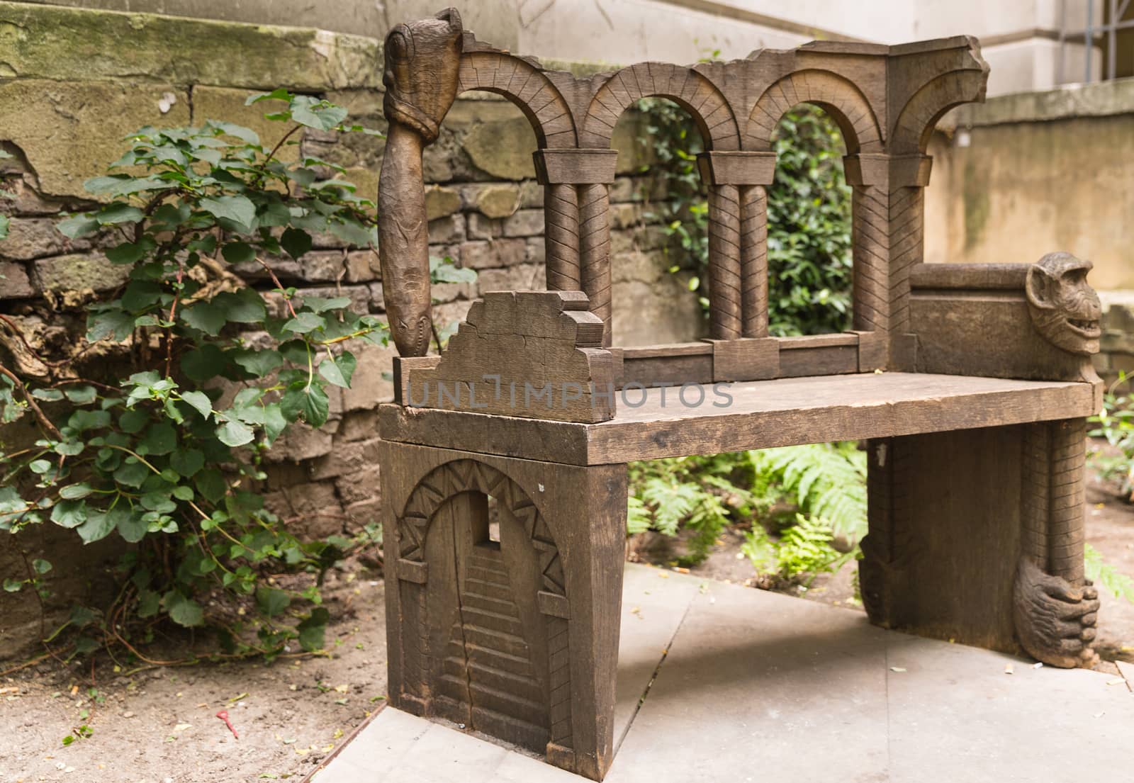 Old carved bench in the heart of the city of London by chrisukphoto