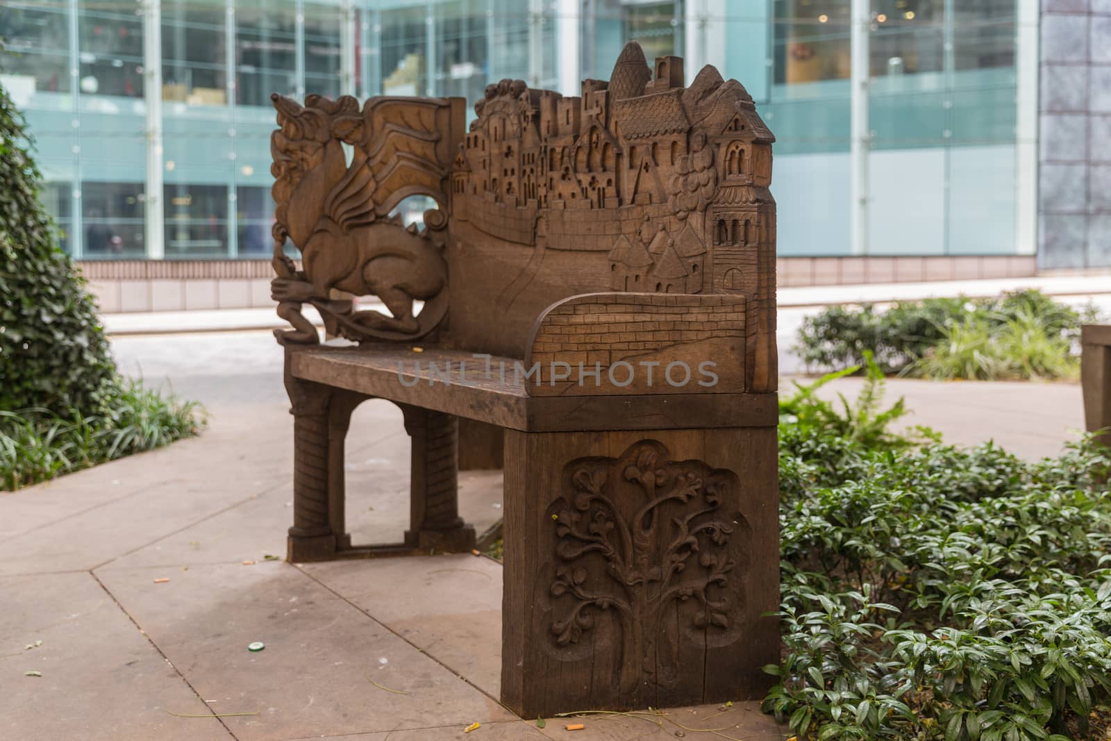Old carved bench in the heart of the city of London - open park area