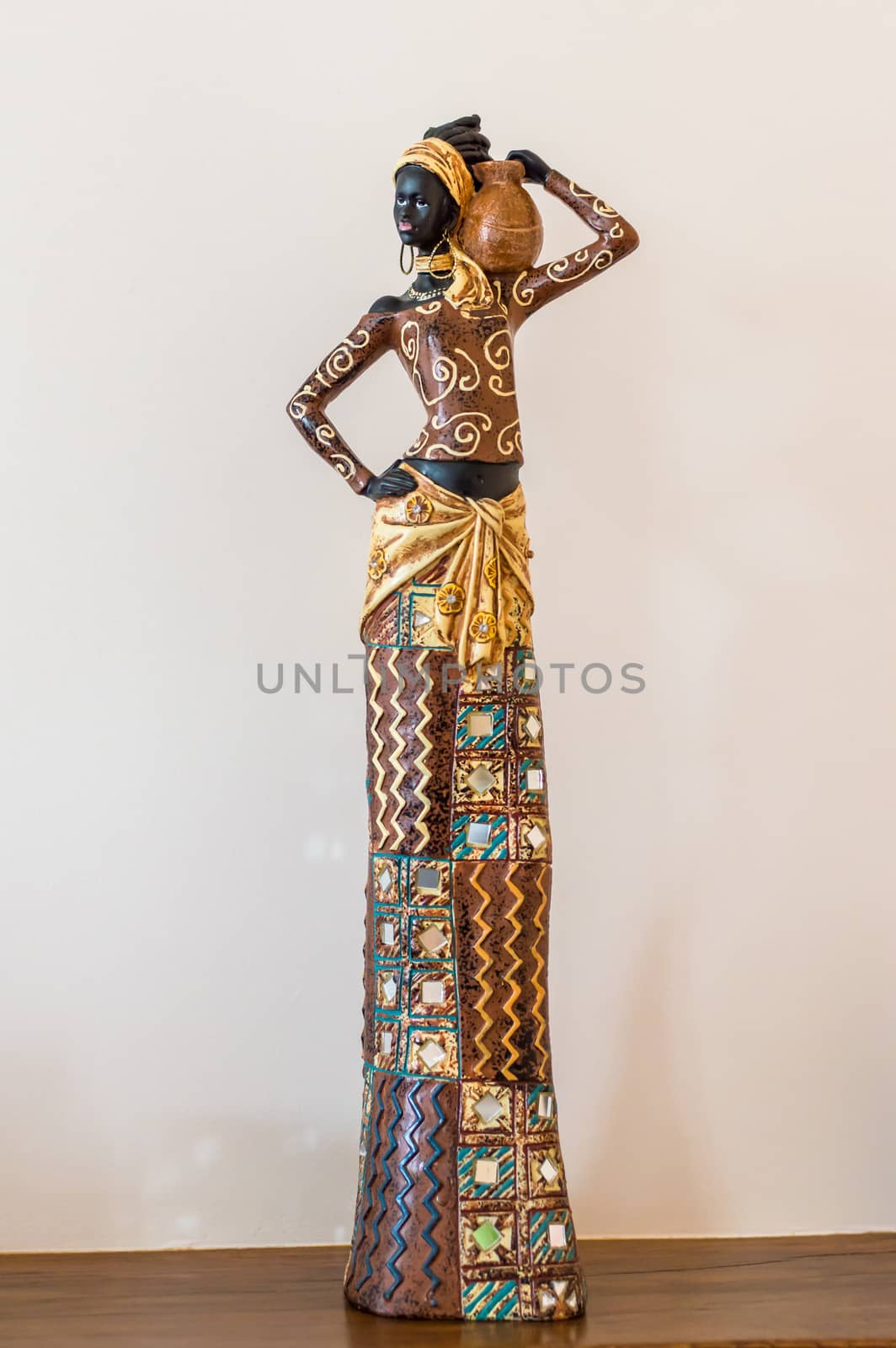 Africa figurine girl on table by okskukuruza