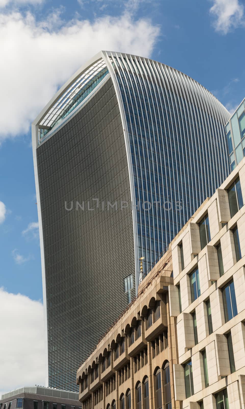 Business and Financial District of London - tall curved building stands above more regular office buildings