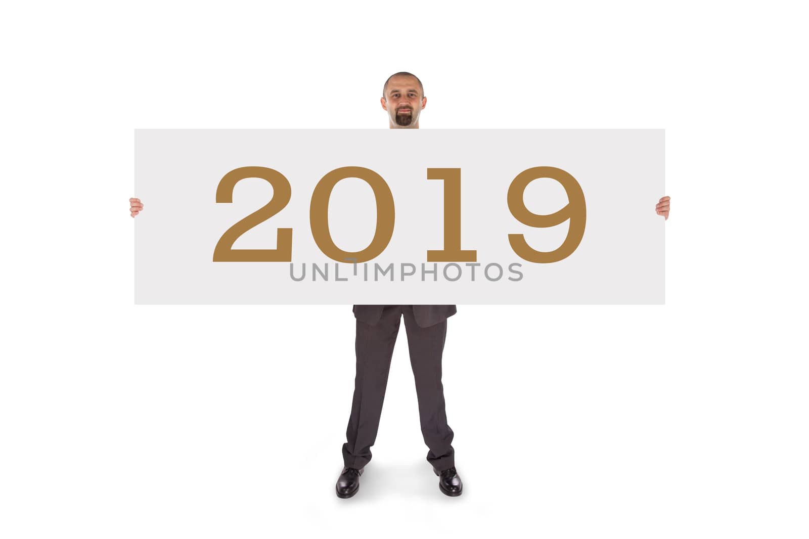 Smiling businessman holding a really big blank card - 2019, isolated on white