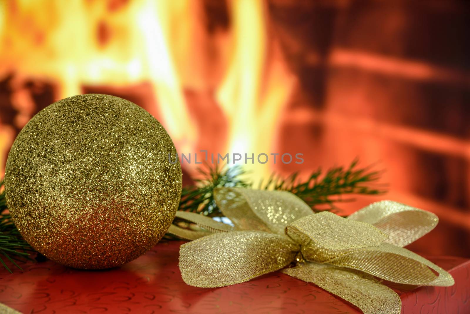 Christmas gift by the fireplace by wdnet_studio