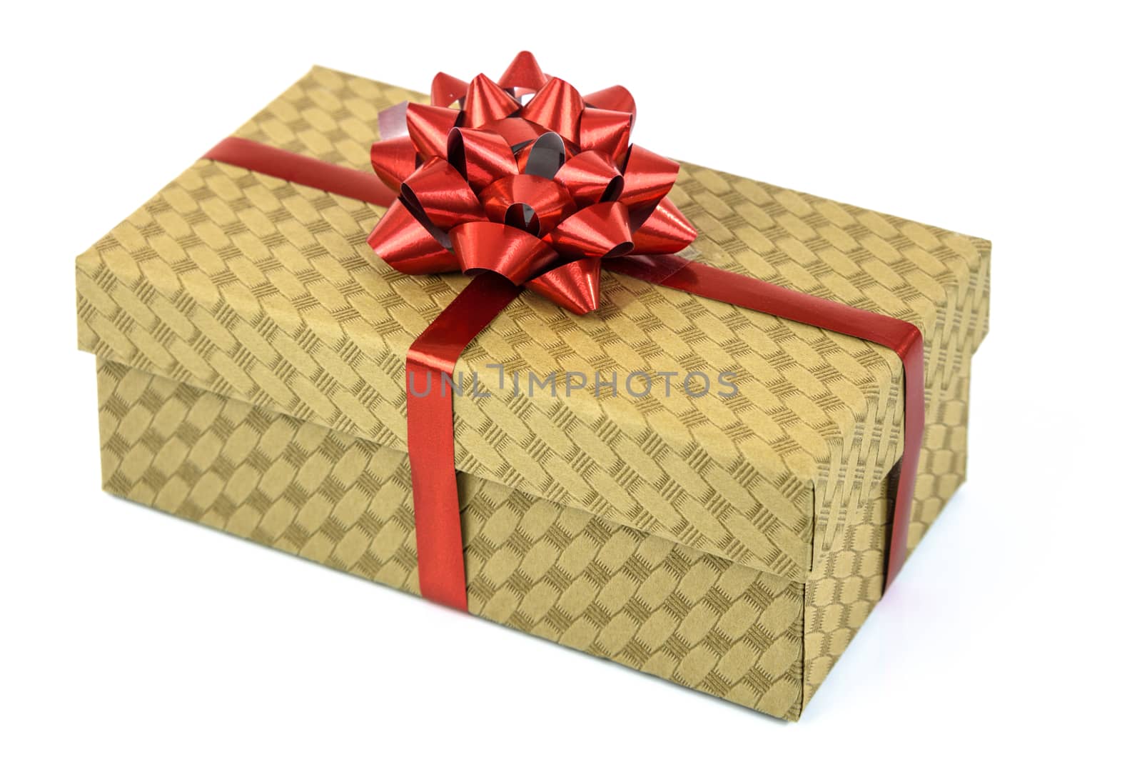 Elegant cardboard box decorated with a red ribbon isolated on a white background