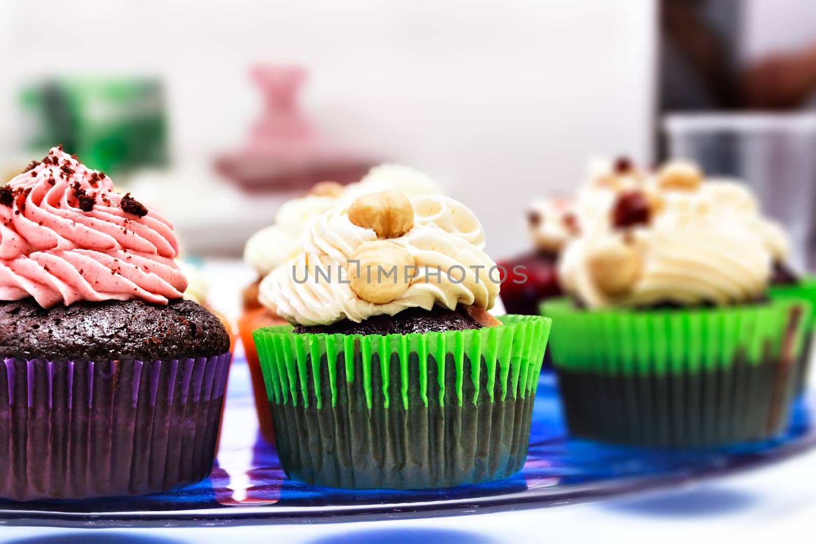 Cupcakes on a blue stand. Horizontal image.