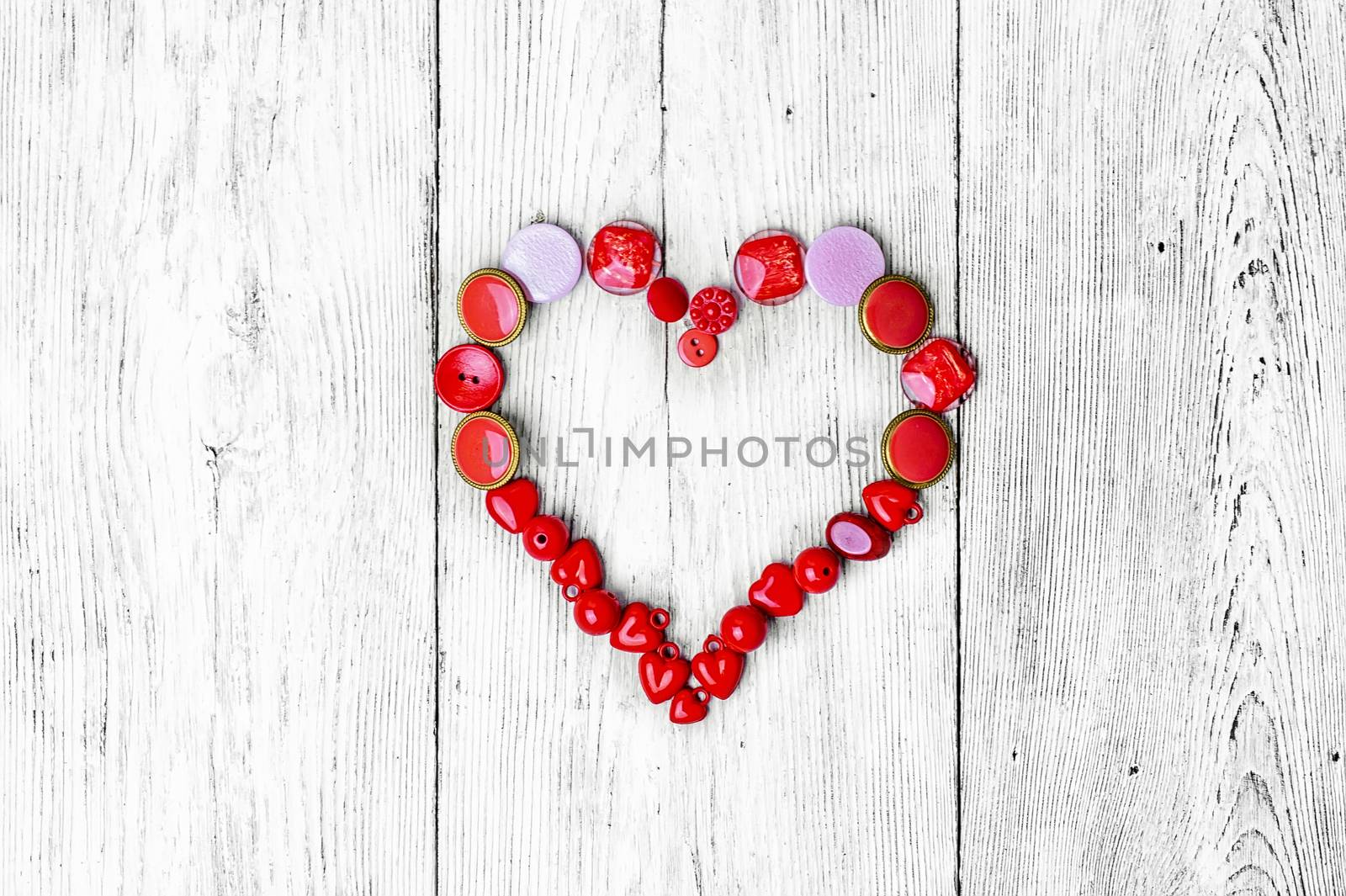 buttons are laid out in the shape of heart for Valentine's day