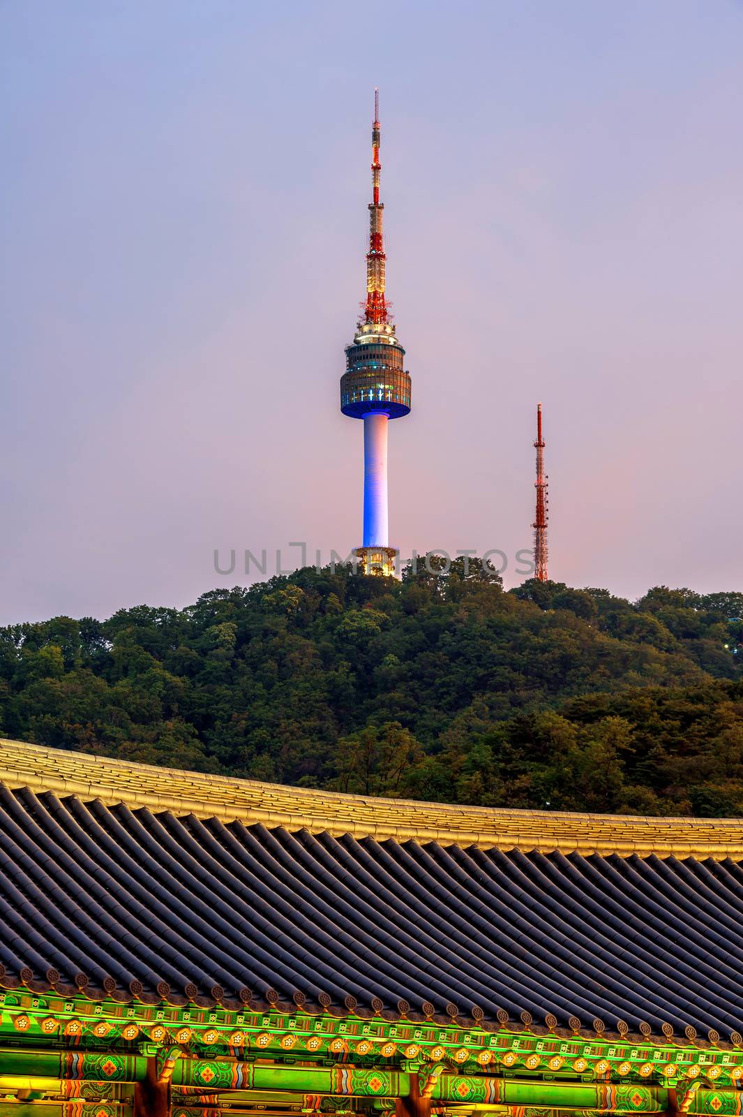Namsangol Hannok Village and Seoul Tower Located on Namsan Mountain at night in Seoul,South Korea.