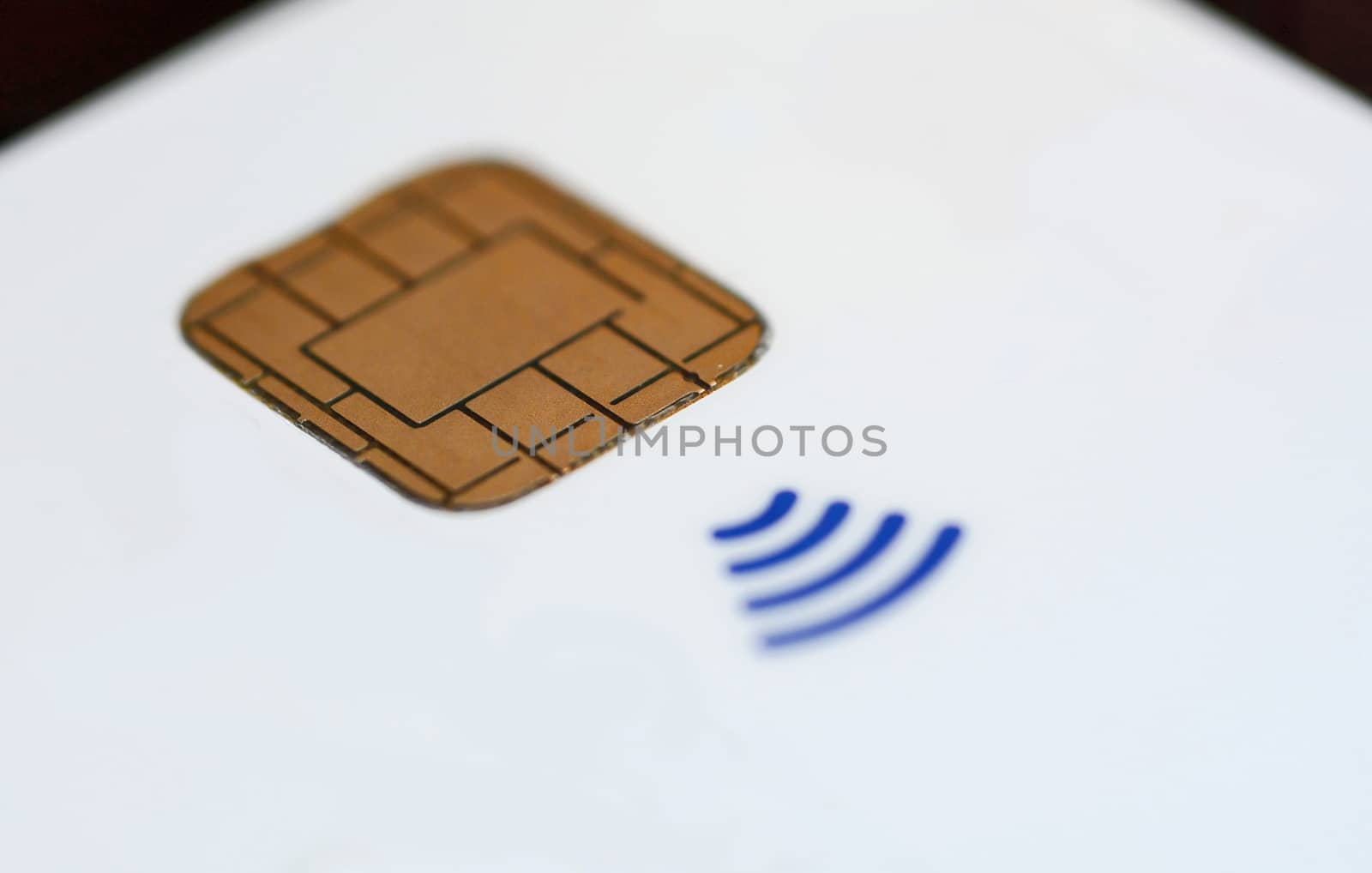 Closeup of a all white contactless credit card without all marks and signs.