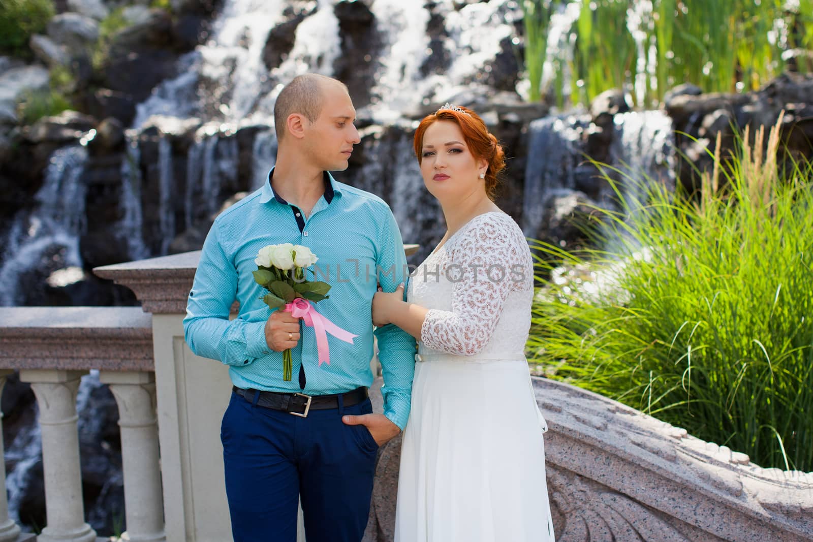 wedding copule. Beautiful bride and groom. Just merried. Close up. Happy bride and groom on their wedding hugging.