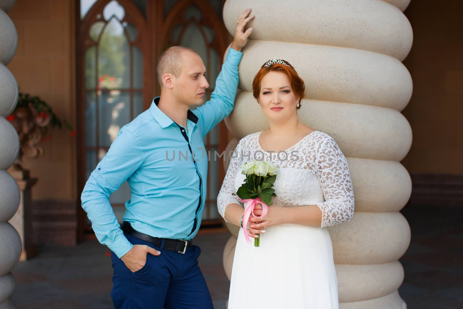 wedding copule. Beautiful bride and groom. Just merried. Close up. Happy bride and groom on their wedding hugging.