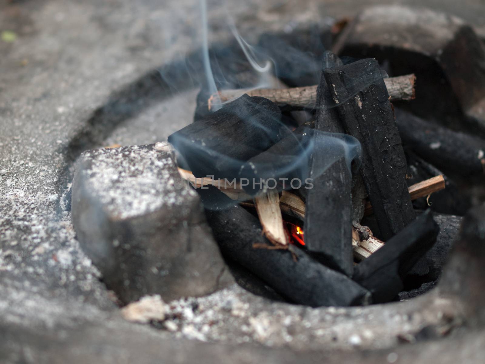 COLOR PHOTO OF CHARCOAL FIRE IN STOVE