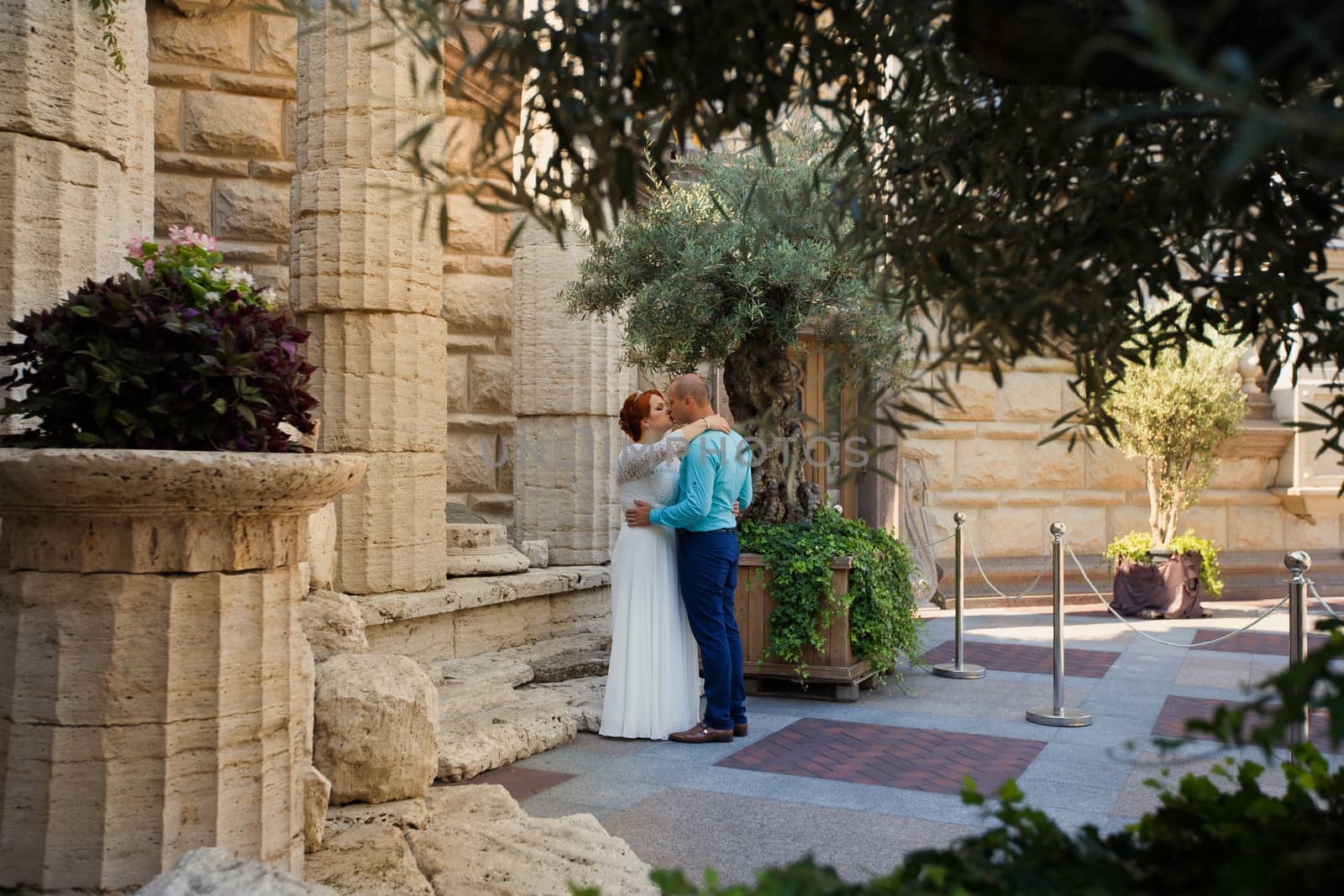 wedding copule. Beautiful bride and groom. Just merried. Close up. Happy bride and groom on their wedding hugging.