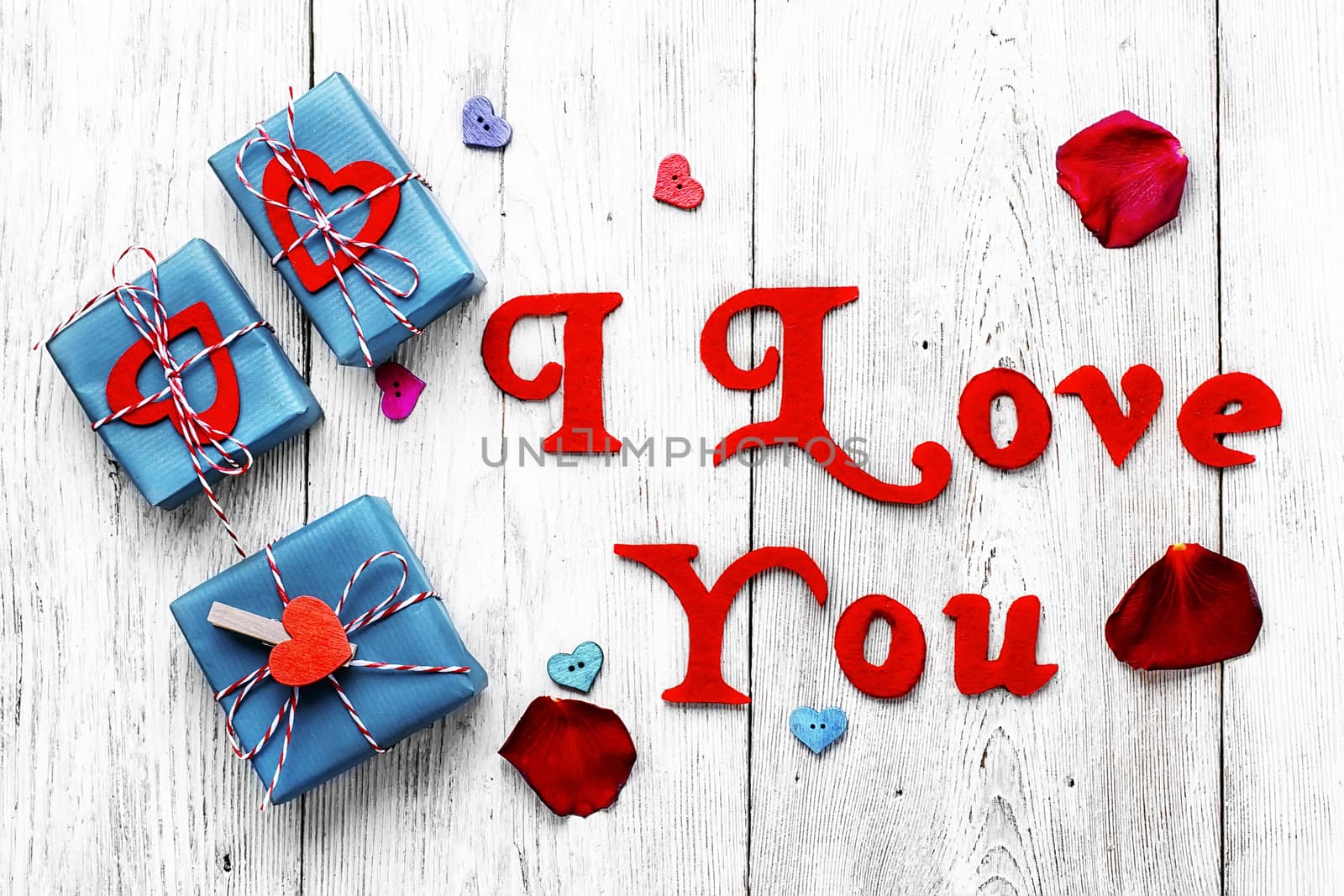 Valentines concept with wrapped gift on white wooden table