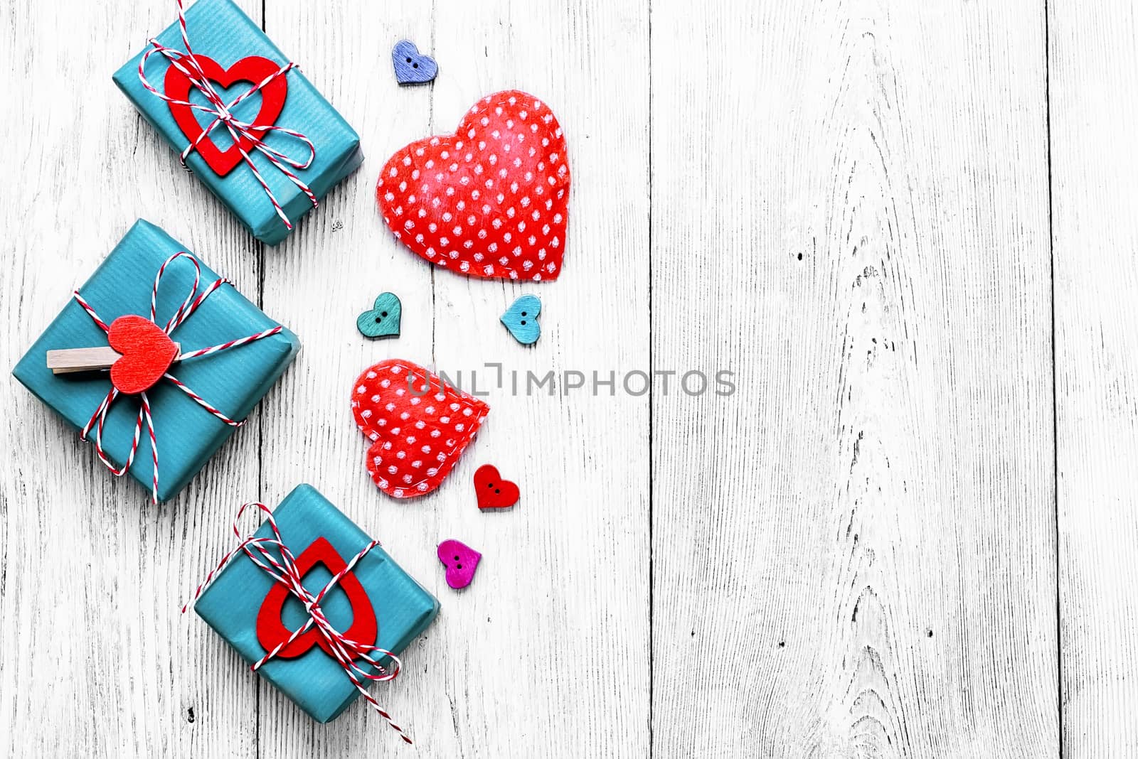 Valentines concept with wrapped gift on white wooden table