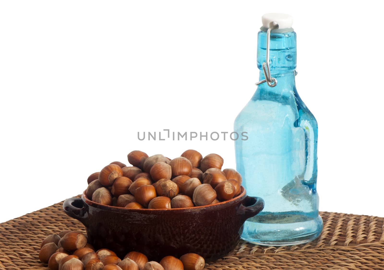 some hazelnuts placed over a white background