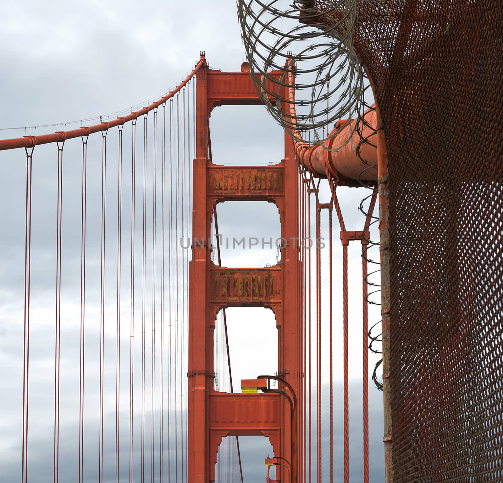 golden gate bridge tower with barbed wire in san francisco