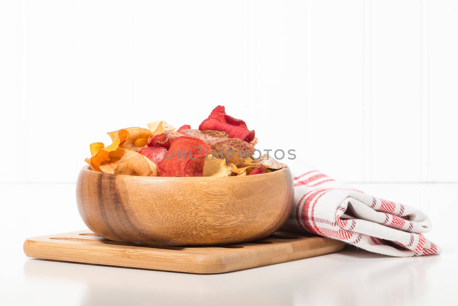Bowl of exotic root vegetable chips with copy space.