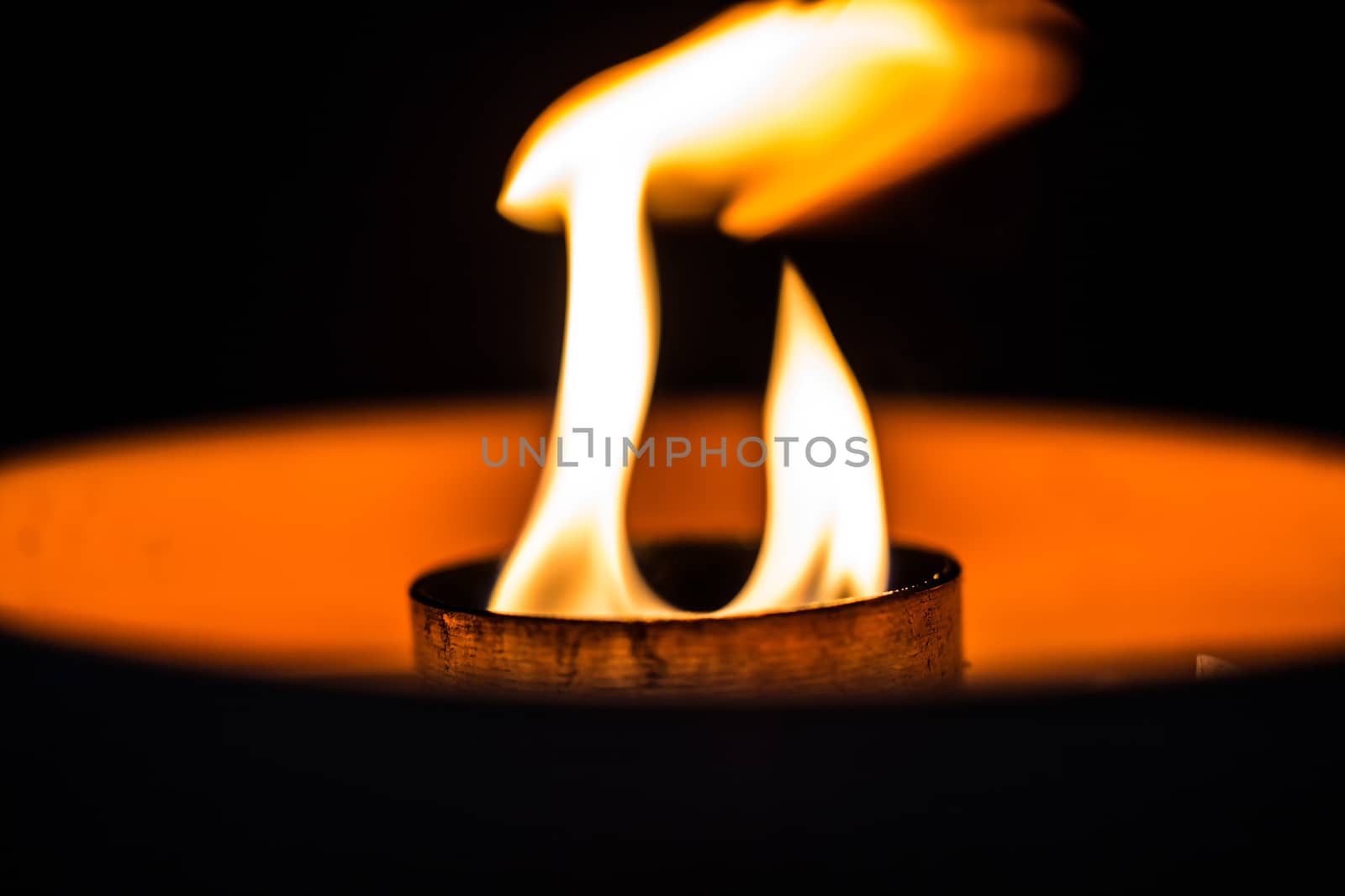A candle flickering in the dark
