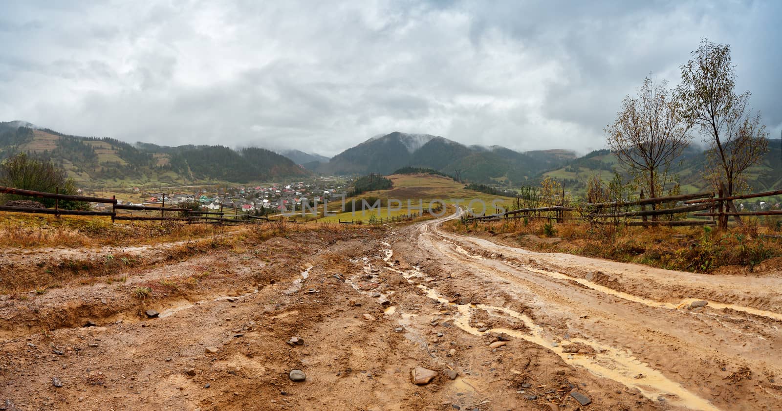Muddy ground after rain in mountains. Extreme path rural dirt ro by weise_maxim
