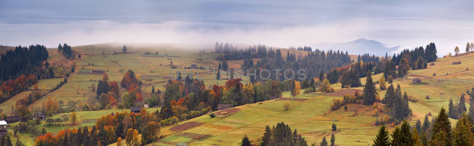 Rainy landscape of mountain village. Overcast autumn panorama.  by weise_maxim