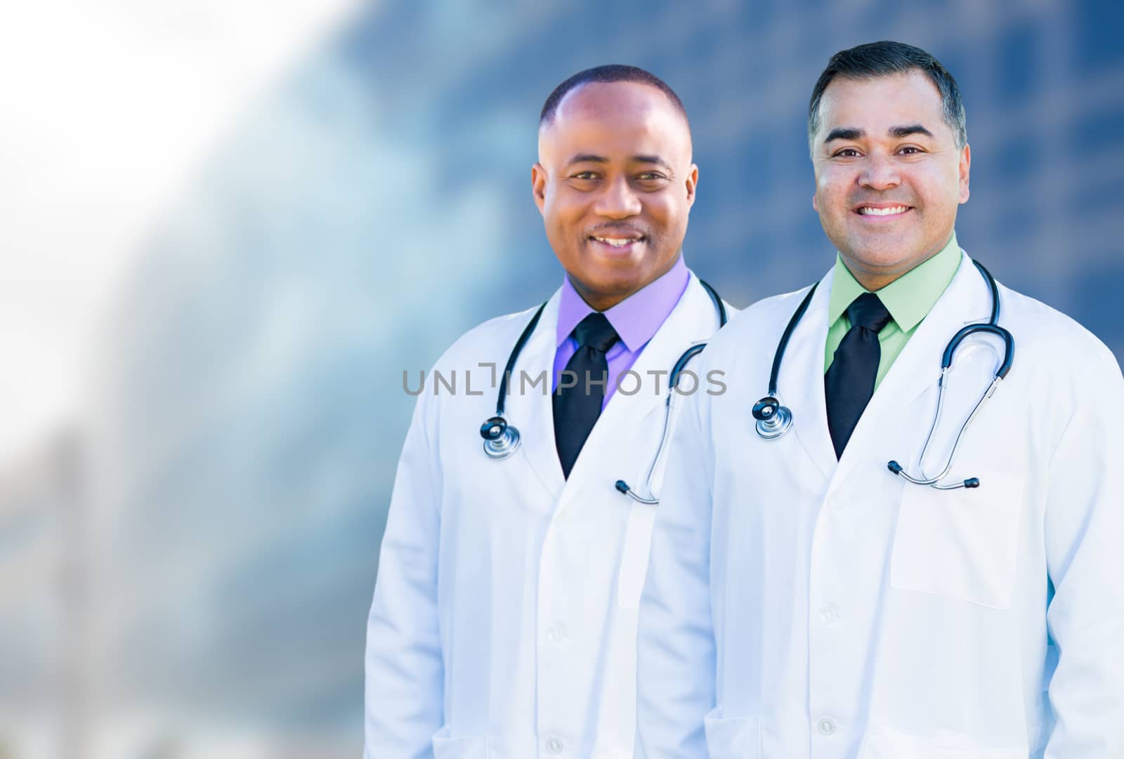 African American and Hispanic Male Doctors Outside of Hospital B by Feverpitched