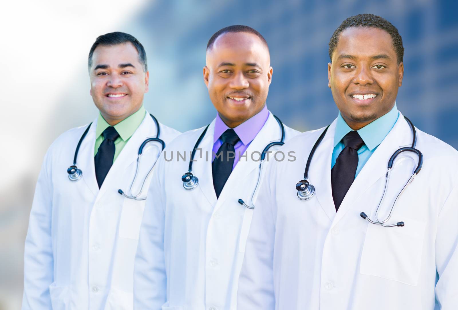 Handsome African American and Hispanic Male Doctors Outside of Hospital Building.