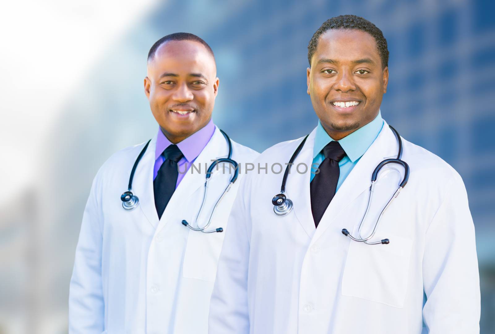 African American Male Doctors Outside of Hospital Building by Feverpitched