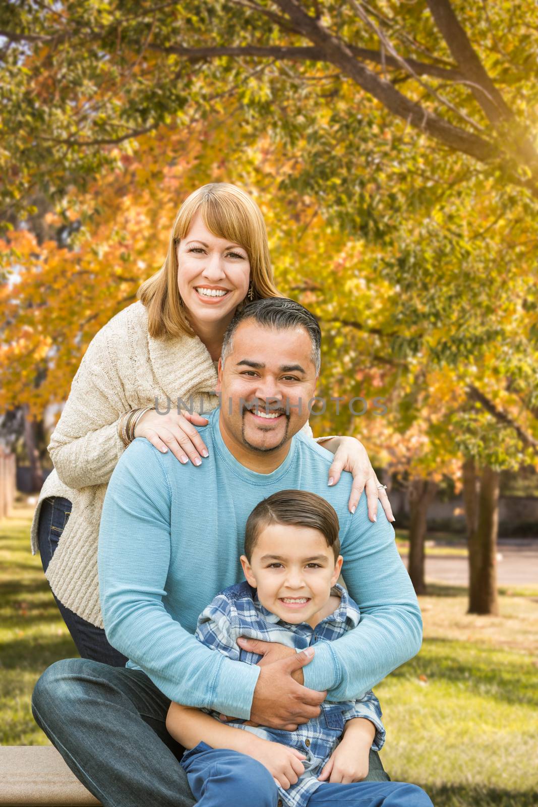 Happy Mixed Race Hispanic and Caucasian Family Portrait at the Park.