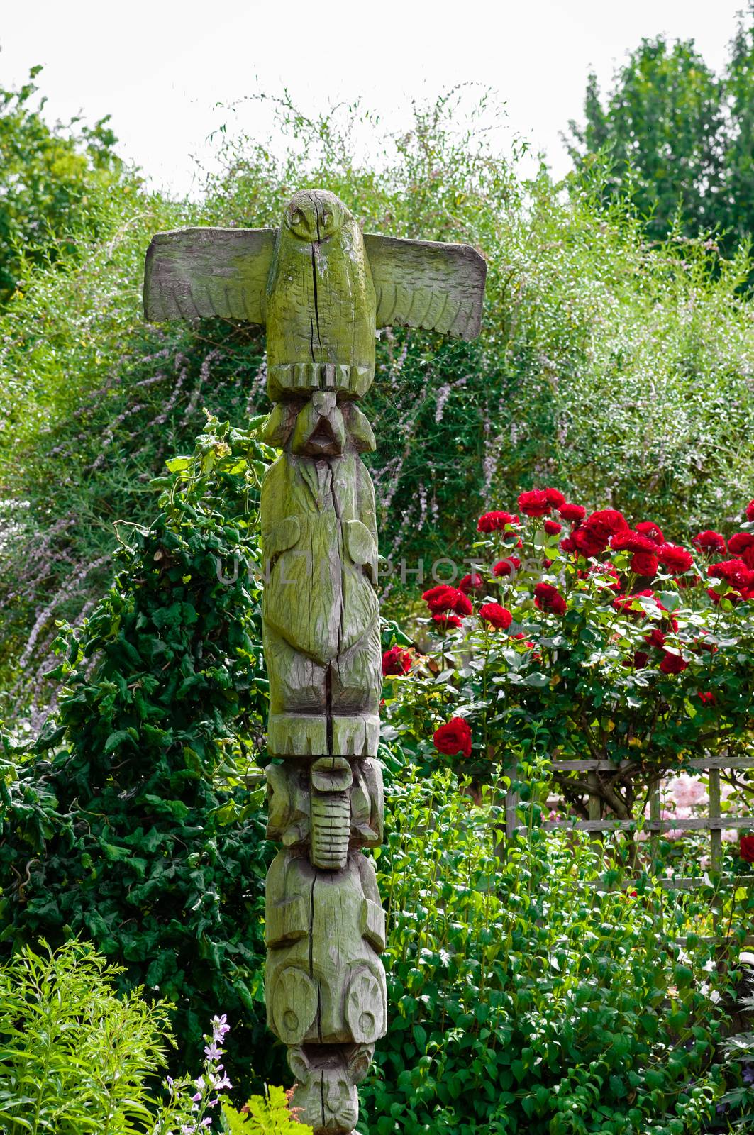 Decorative garden sculpture weathered wood outdoors in natural setting