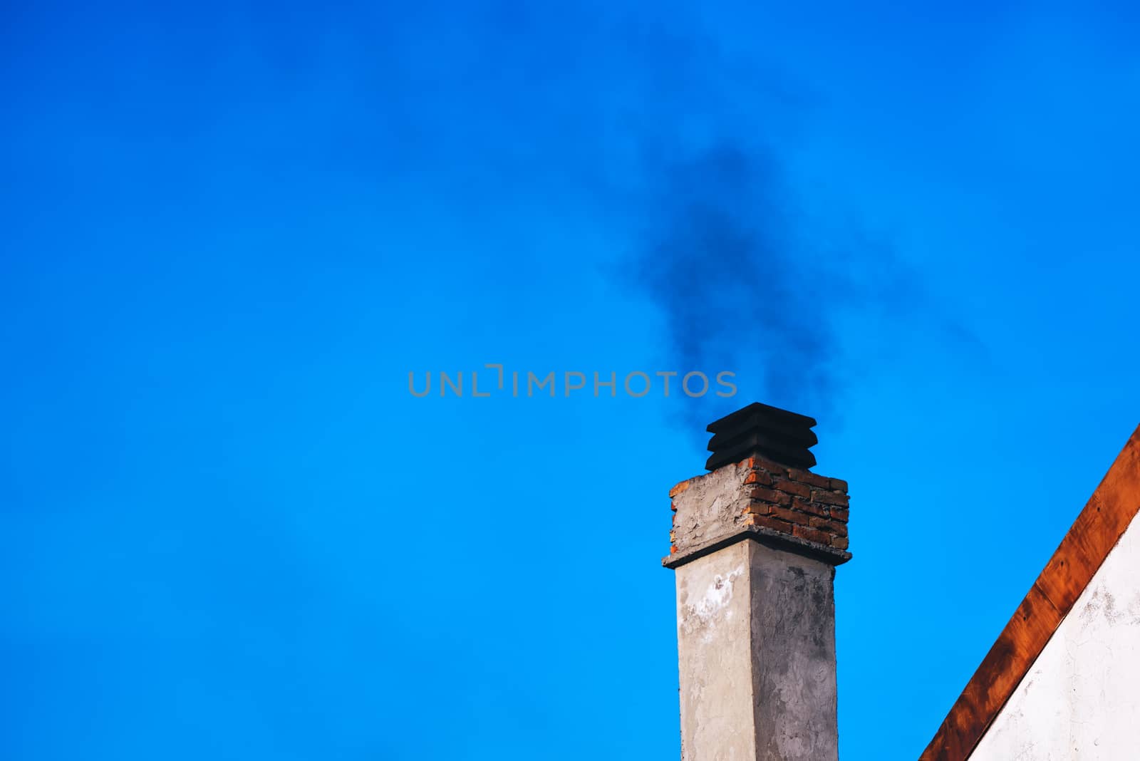 Smoke from house chimney by stevanovicigor