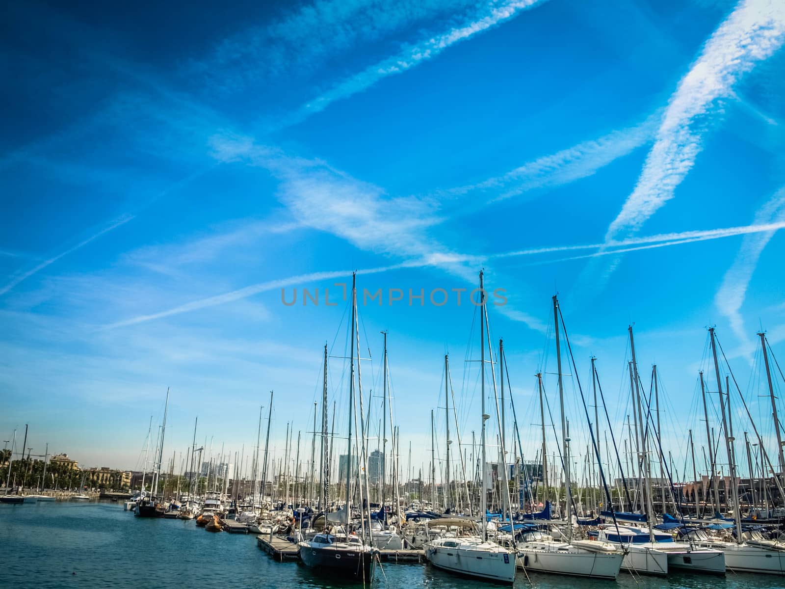 Spain. Barcelona. Yacht club at sunset. A lot of masts