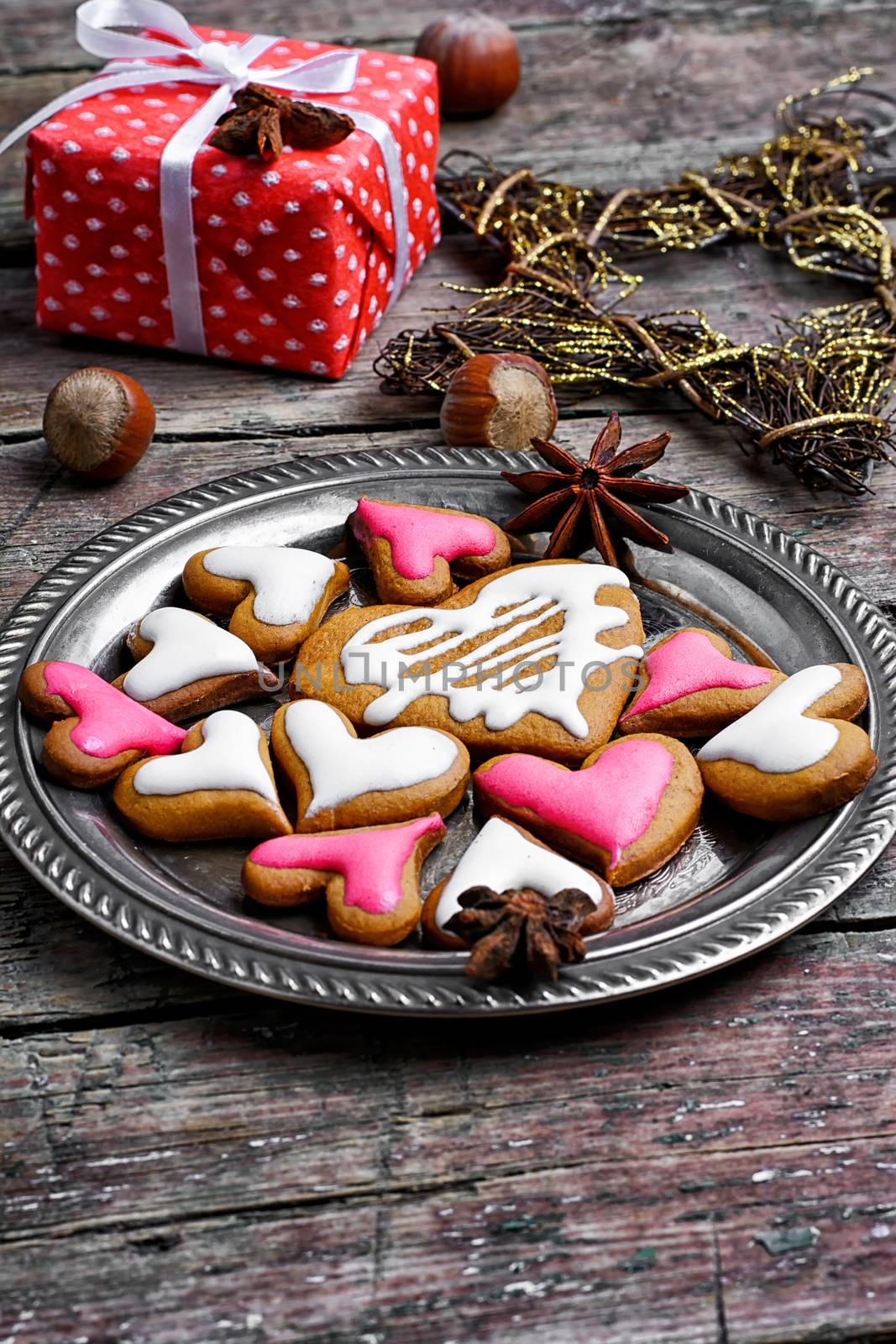 Homemade Christmas cookies in the shape of hearts on saucer