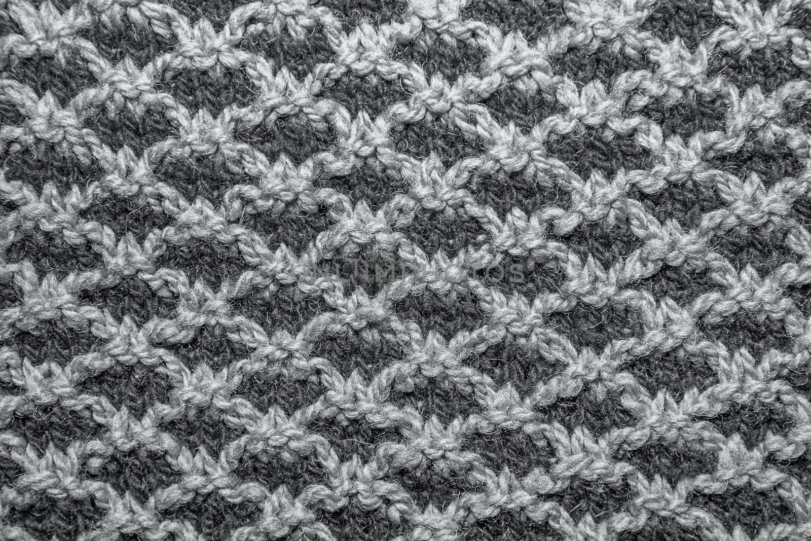 Brown knitted cloth is made by hand. It is decorated with pineapple bulging pattern.