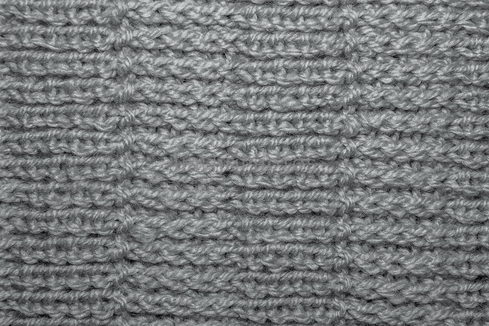 Wool hand-knitted Pattern. Closeup Fabric Background