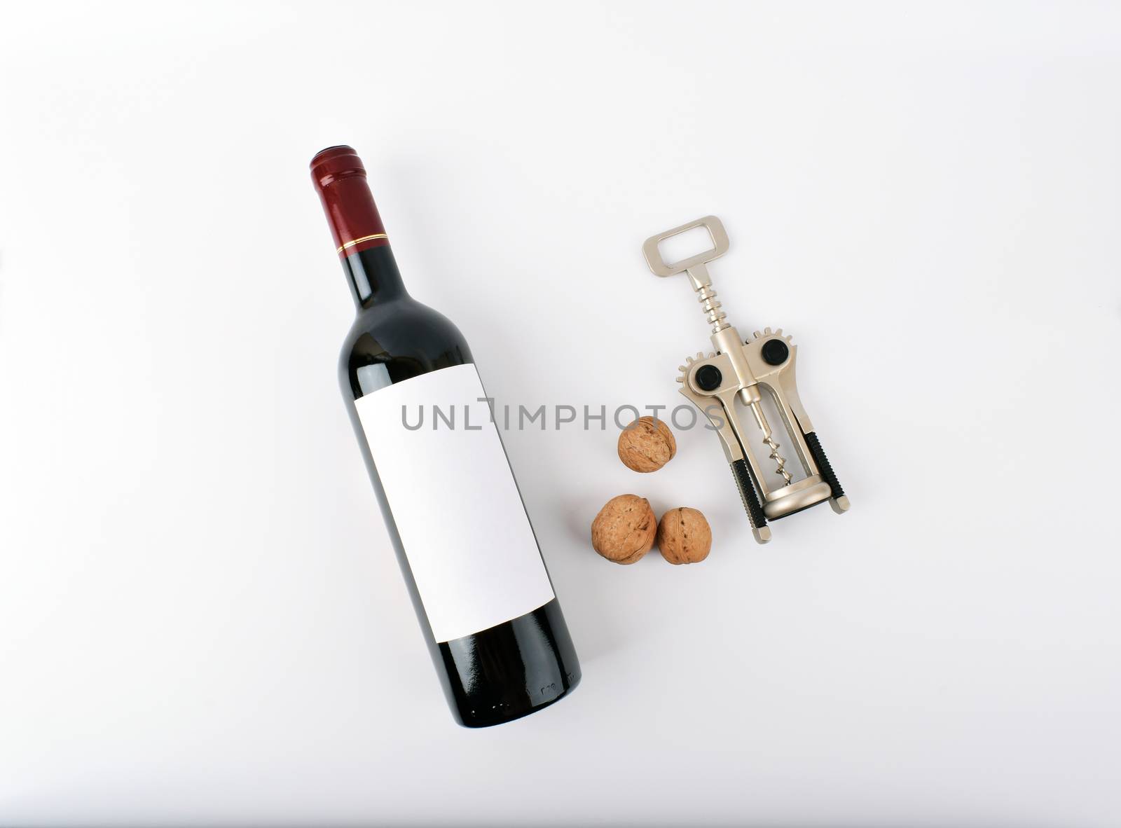 mockup wine bottle with three nuts, isolated on white background with copy space, front view.