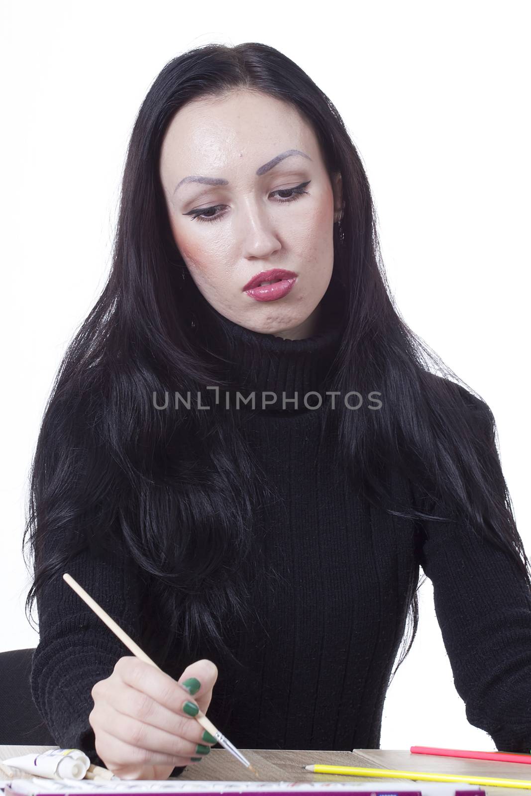 Young girl artist drawing pencils and paints