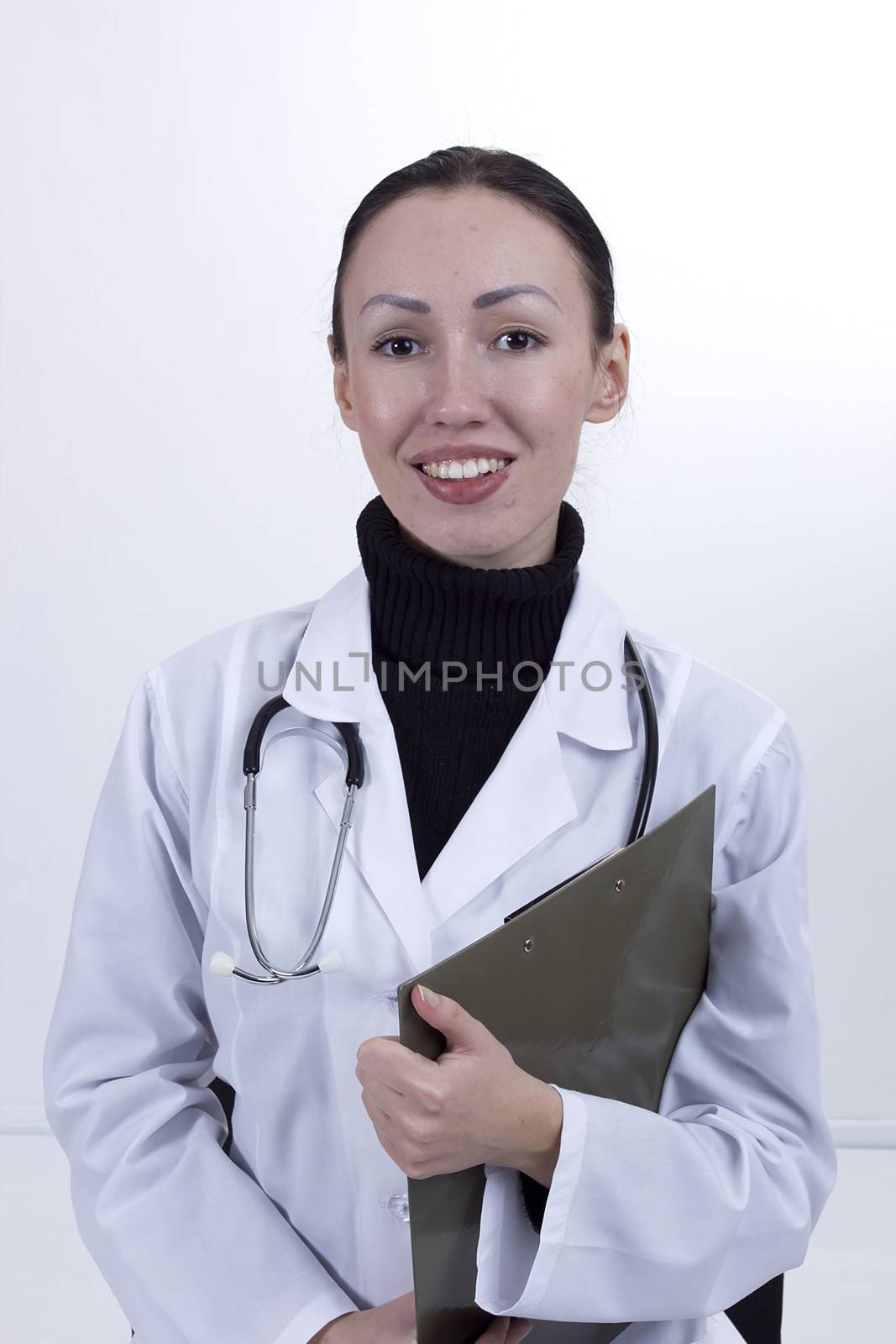 Young female doctor on a white background