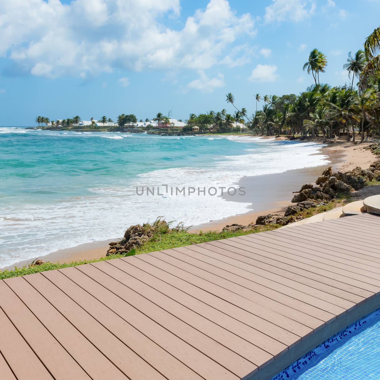 Tropical beach Tobago Caribbean nearby pool and wooden deck square