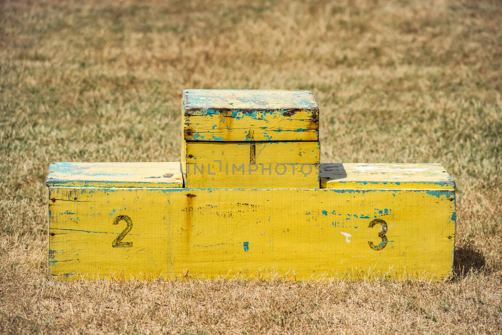 Handmade podium yellow outdoors wooden pedestal contest ceremony sports position empty by Altinosmanaj