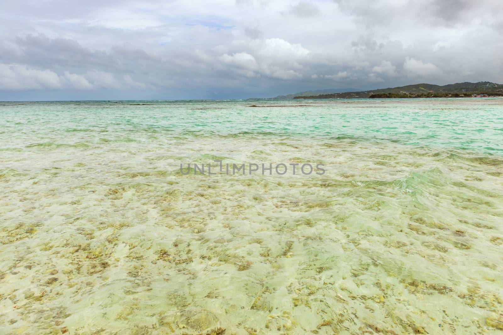 Nylon Pool in Tobago tourist attraction shallow depth of clear sea water covering coral and white sand panoramic view