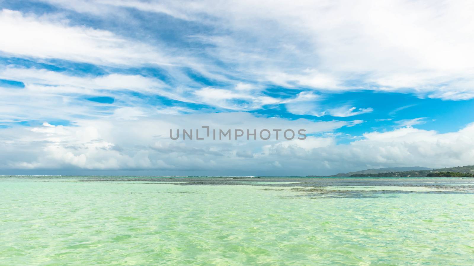 Nylon Pool in Tobago tourist attraction shallow depth of clear sea water covering coral and white sand panoramic view