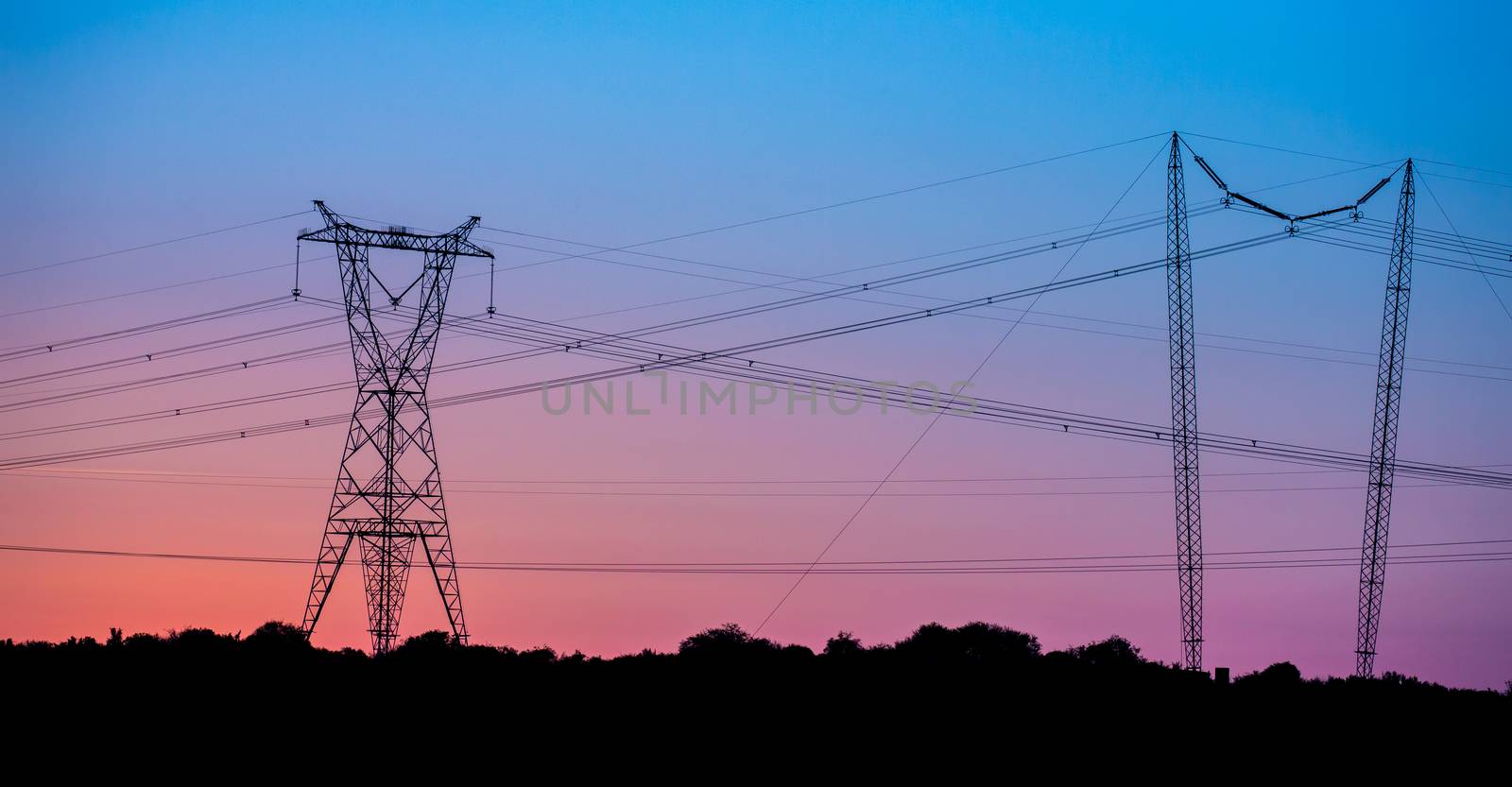 Electricity Pylons at Sunset by fouroaks