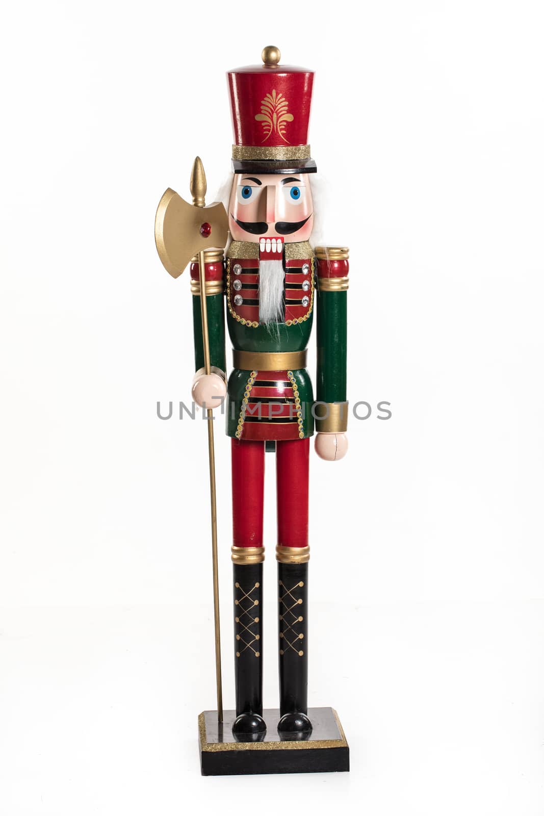 Old handmade nutcracker on an isolated studio background
