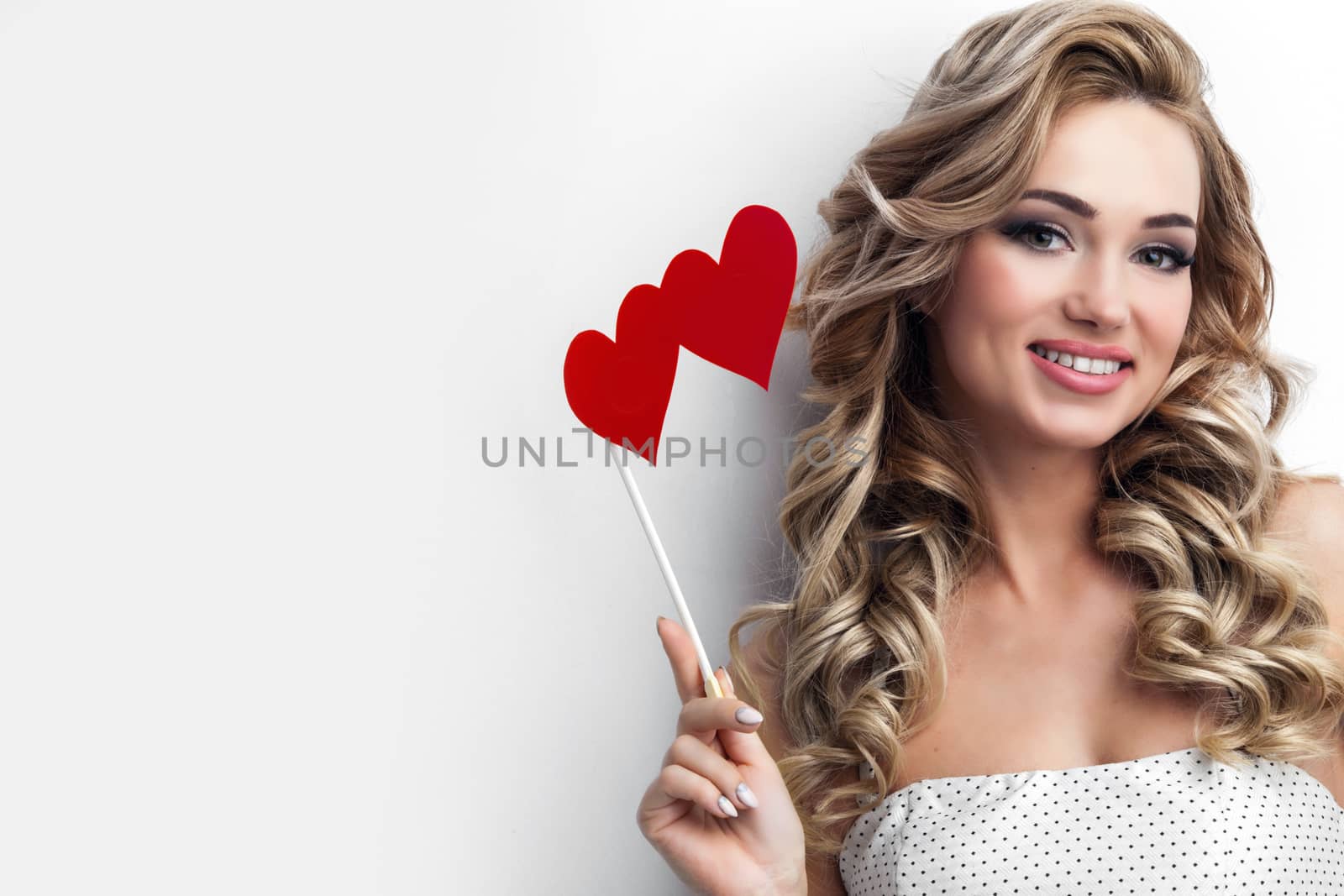 Portrait of pretty woman holdng hearts on stick, Valentines day conceot