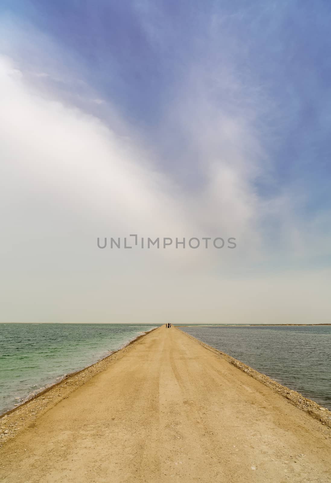 road from sand through the dead sea